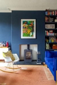 Wood Burner and Dark Blue Walls In Edwardian House