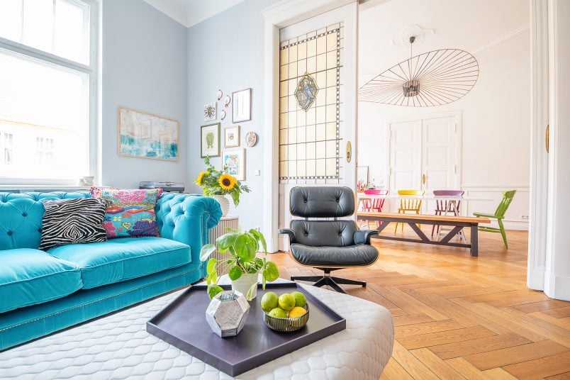 Living Room With Turquoise Chesterfield, Ottoman and Ribbed Sidetable