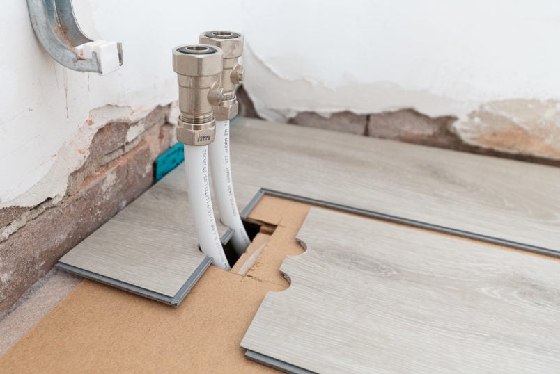 how to lay vinyl plank floor around radiator pipes