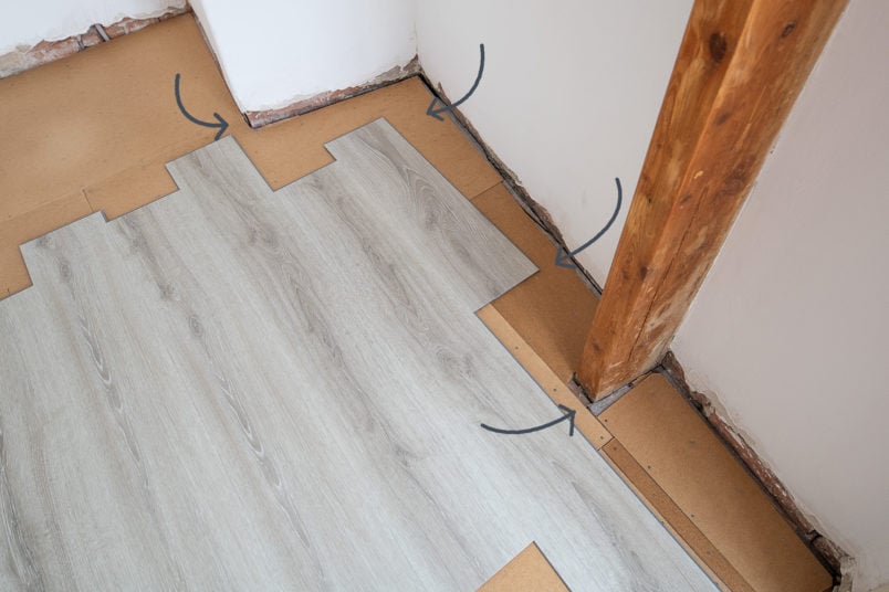 Laying-Vinyl-Plank-Floor---Testing-Width-of-Planks-For-Space---Little-House-On-The-Corner