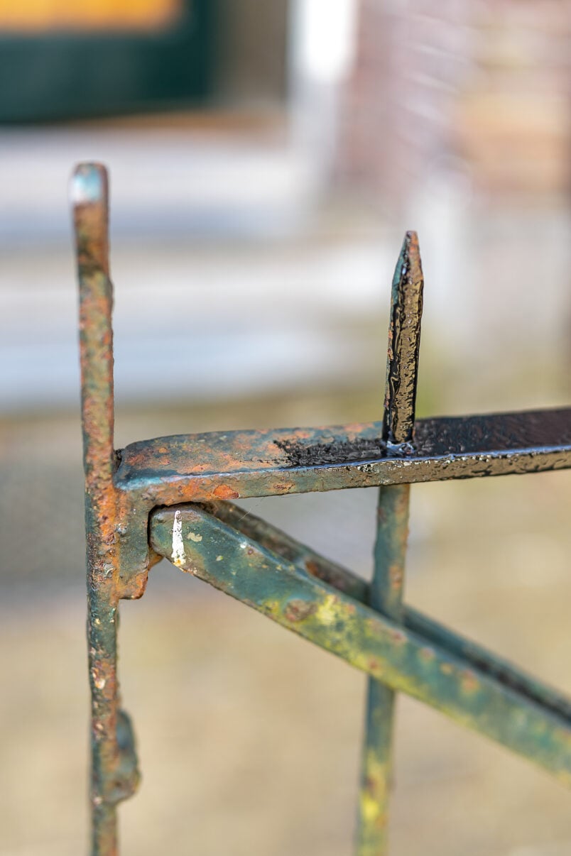 Painting a rusty metal fence