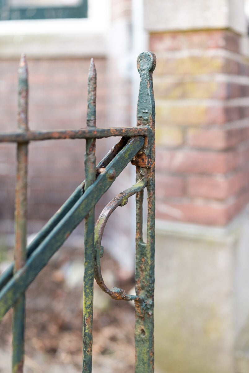 rusty green metal gate