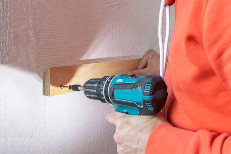 attaching french cleat to wall with screw and cordless drill